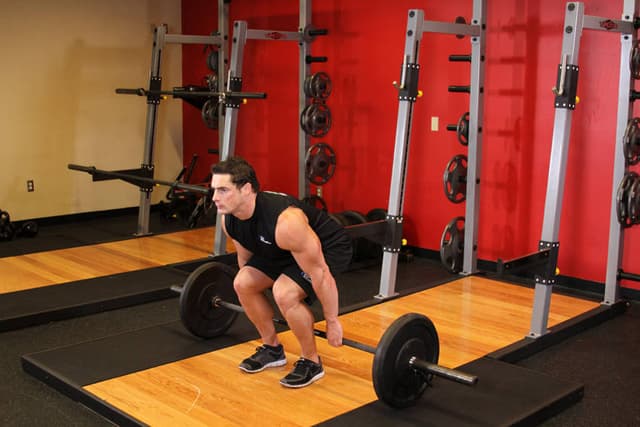 Starting position of Barbell Hack Squat