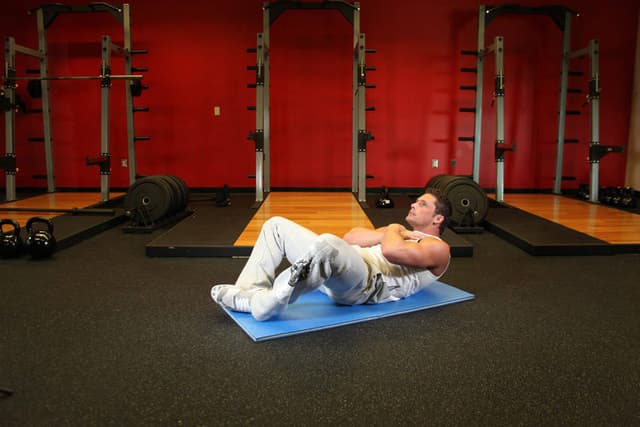 Ending position of Frog Sit-Ups