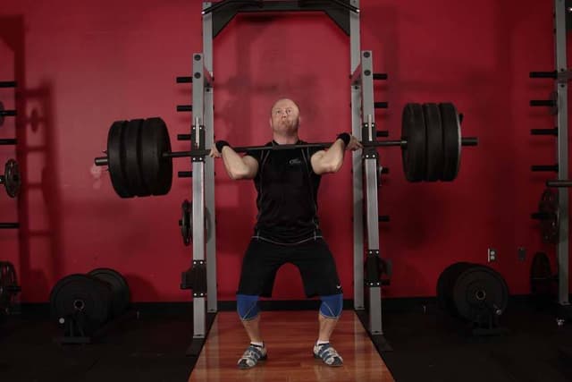 Ending position of Jerk Dip Squat