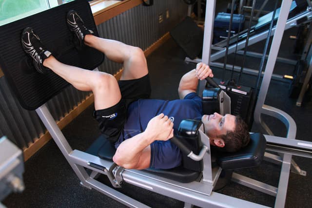 Starting position of Lying Machine Squat