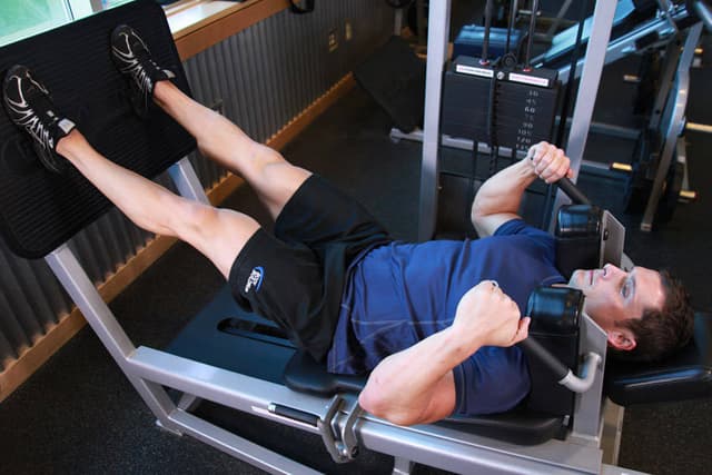 Ending position of Lying Machine Squat