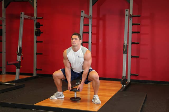 Ending position of Plie Dumbbell Squat