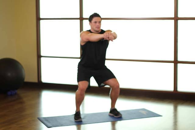 Ending position of Sit Squats