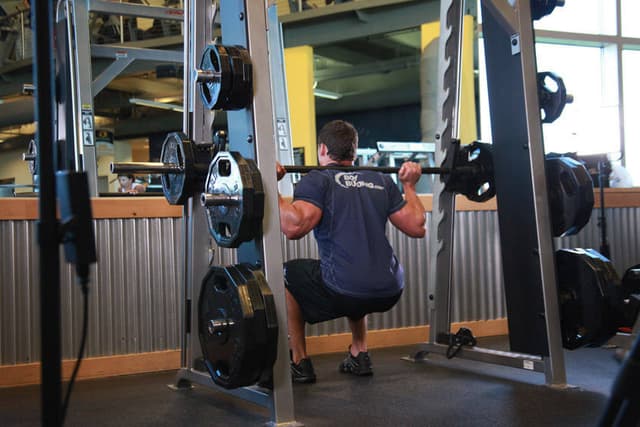 Starting position of Smith Machine Squat